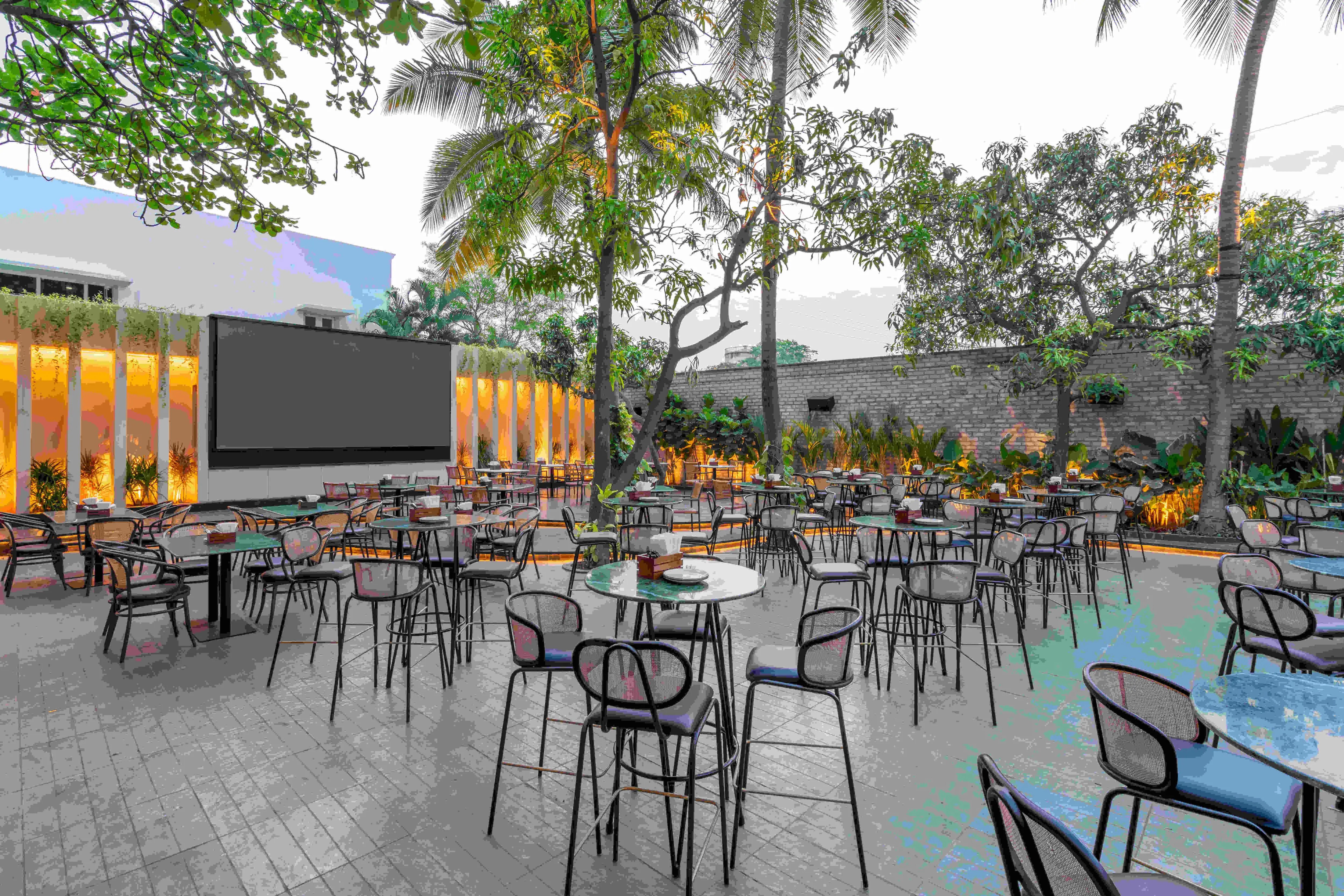 Tables facing the projection wall in daylight.